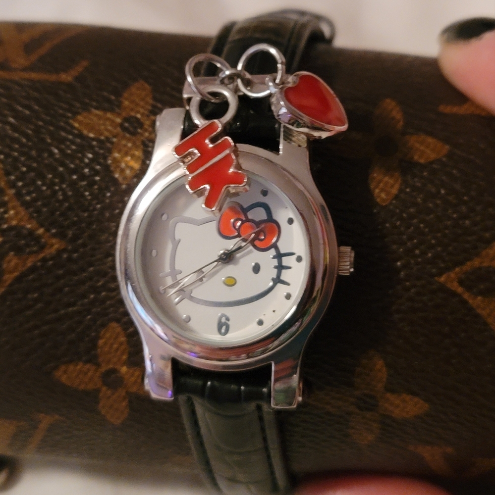 NWOT Sanrio Hello Kitty Womens Charm Quartz Watch Black Leather Band Silver Case
